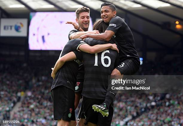 Emilio Izaguirre and Charlie Mulgrew jump on Georgios Samaras and Joe Ledley Celtic after Ledley scored a goal during the William Hill Scottish Cup...