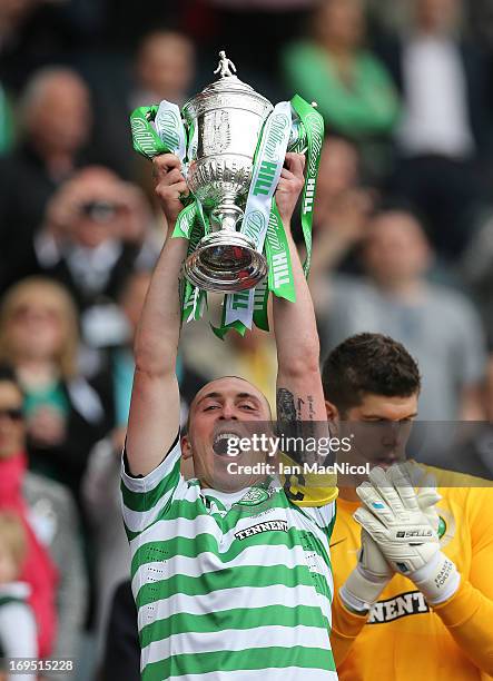 Celtic captain Scott Brown lifts the trophy after defeating Hibernian 3-0 during the William Hill Scottish Cup Final match between Celtic and...