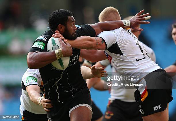 Ukuma Ta'ai of Huddersfield Giants is tackled by Danny Addy of Bradford Bulls during the Magic Weekend at Etihad Stadium on May 26, 2013 in...