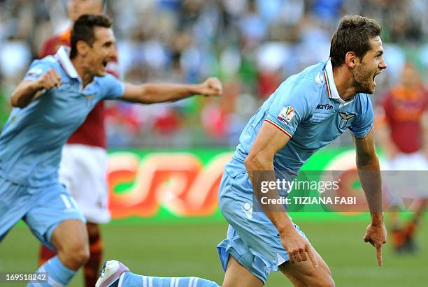 Lazio's Bosnian defender Senad Lulic celebrates with Lazio's German forward Miroslav Klose after scoring during the Italian Cup football final...