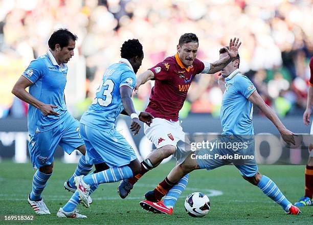 Francesco Totti of AS Roma competes for the ball with SS Lazio players during the TIM cup final match between AS Roma v SS Lazio at Stadio Olimpico...