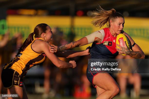 Tayla Harris of the Demons runs with the ball during the round four AFLW match between Hawthorn Hawks and Melbourne Demons at Kinetic Stadium, on...