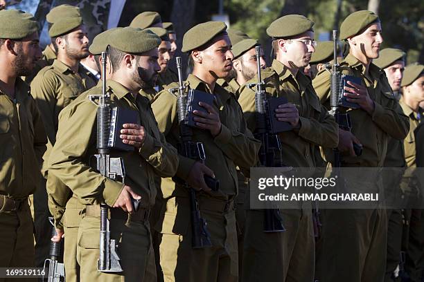 Israeli soldiers from the Ultra-Orthodox battalion "Netzah Yehuda" of the army's Kfir Brigade stand to attention during a swearing-in ceremony at the...