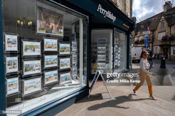 Houses for sale in an estate agents window on 13th September 2023 in Cirencester, United Kingdom. Cirencester is known for having a large volume of...