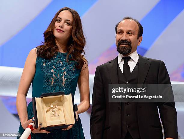 Actress Berenice Bejo poses with director Asghar Farhadi after being awarded with the Prix d'Interpretation Feminine at the Inside Closing Ceremony...