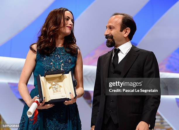 Actress Berenice Bejo poses with director Asghar Farhadi after being awarded with the Prix d'Interpretation Feminine at the Inside Closing Ceremony...