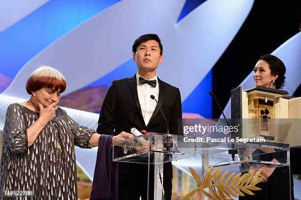 Singaporean director Anthony Chen poses on stage with director Agnes Varda and Chinese actress and member of the Un Certain Regard Jury Zhang Ziyi...