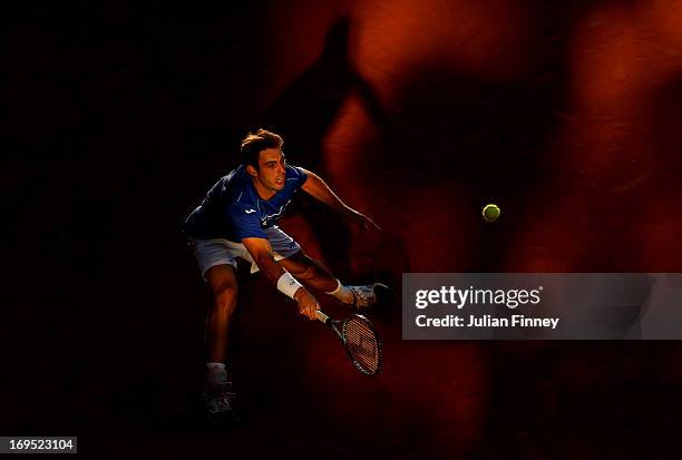 Marcel Granollers of Spain plays a forehand during his men's singles match against Feliciano Lopez of Spain on day one of the French Open at Roland...