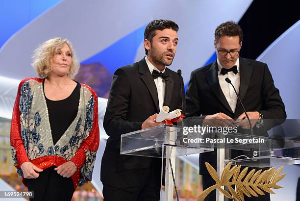 Actor Oscar Isaac speaks on stage after he received for directors Joel and Ethan Coen the Grand Prix award for 'Inside Llewyn Davis' on stage during...