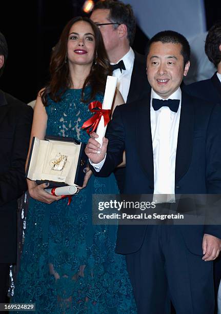 Actress Berenice Bejo, winner of the Prix d'Interpretation Feminine and Jia Zhangke of 'Tian Zhu Ding' , winner of the Prix du Scenario pose during...