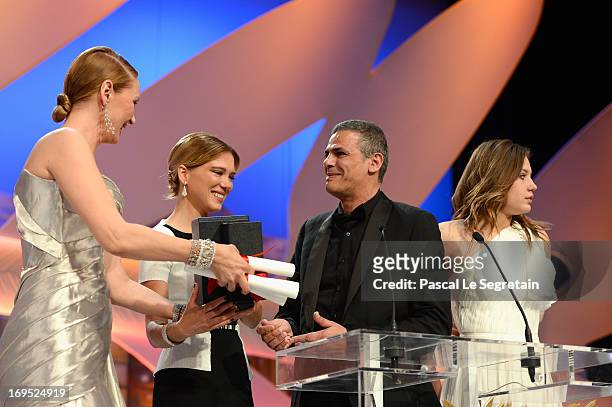 Actress Lea Seydoux, director Abdellatif Kechiche and actress Adele Exarchopoulos celebrates on stage with actress Uma Thurman after 'La Vie D'adele'...