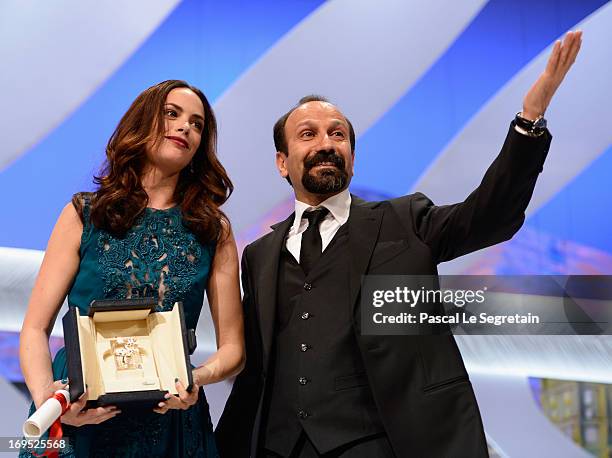 Actress Berenice Bejo poses with director Asghar Farhadi after being awarded with the Prix d'Interpretation Feminine at the Inside Closing Ceremony...