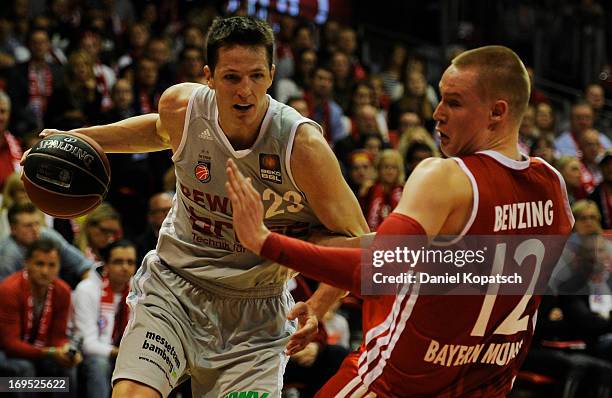 Casey Jacobsen of Bamberg is challenged by Robin Benzing of Muenchen during the second Game of the semifinals of the Beko Basketball Playoffs match...