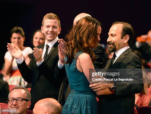 Actress Berenice Bejo reacts with director Asghar Farhadi after it is announced that she won the Prix d'Interpretation Feminine for 'Le Passe' at the...