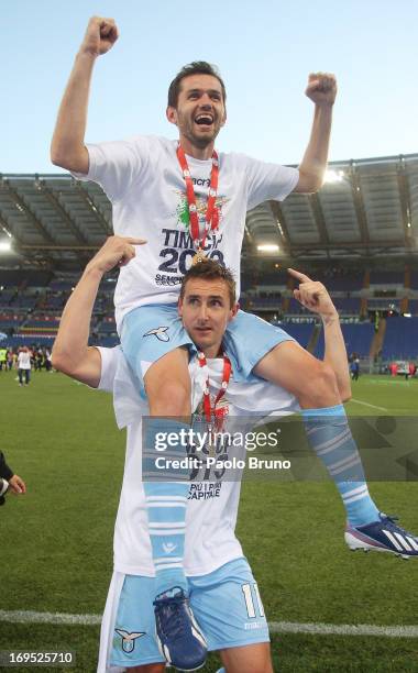 Miroslav Klose with Senad Lulic of SS Lazio celebrate after winning the Tim cup final against AS Roma at Stadio Olimpico on May 26, 2013 in Rome,...