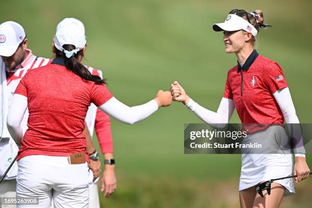 Nelly Korda and Allisen Corpuz of Team USA fist bump on the 13th green during Day One of The Solheim Cup at Finca Cortesin Golf Club on September 22,...