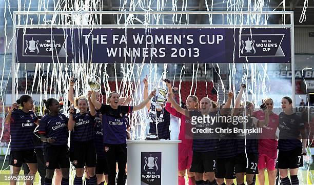 Arsenal Ladies FC player Kelly Smith lifts the trophy with captain Stephanie Houghton following the The FA Women's Cup Final between Bristol Academy...