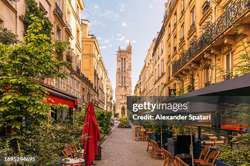 Street with cafes and Saint-Jacques Tower in Paris, France Street with cafes and Saint-Jacques Tower in Paris, France