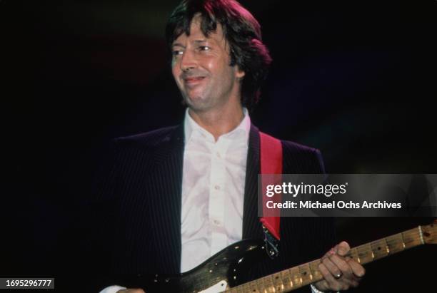 Eric Clapton performing on stage at a charity concert for ARMS , held at the Royal Albert Hall, London, United Kingdom, 20th September 1983.