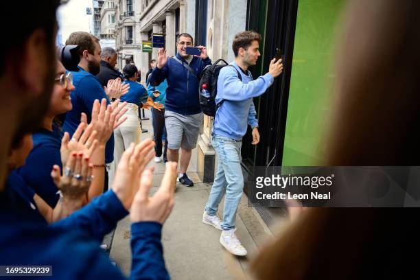 Customers enter to purchase iPhone 15 handsets at the Apple Store on September 22, 2023 in London, England. After Apple's announcement of the iPhone...