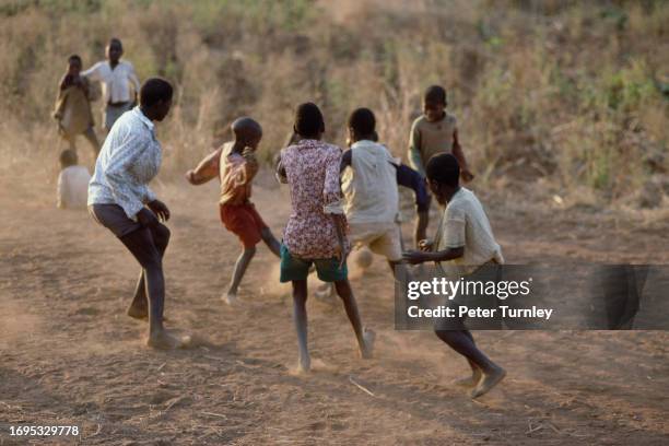 Child refugees play a game of football in Malawi, August 1988.