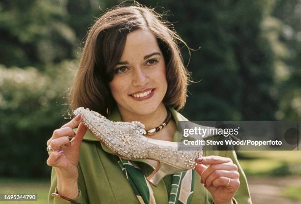 Irish actress Gemma Craven holding the slippper during a promo photo-shoot after playing Cinderella in the film The Slipper and the Rose in London,...