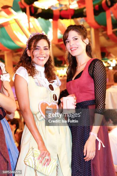 German actress Amy Mussul and German actress Jasmin Gassmann during the Madlwiesn at Oktoberfest at Schuetzenfestzelt on September 21, 2023 in...