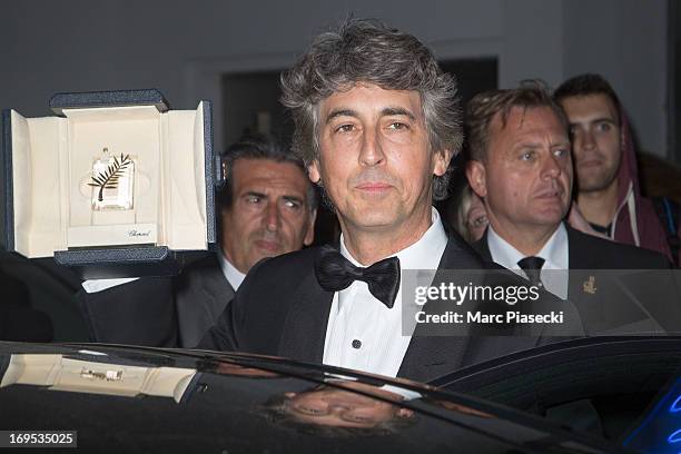 Director of 'Nebraska' Alexander Payne poses with the 'Prix D'Interpretation Masculine' which he received on behalf of Bruce Dern for his performance...