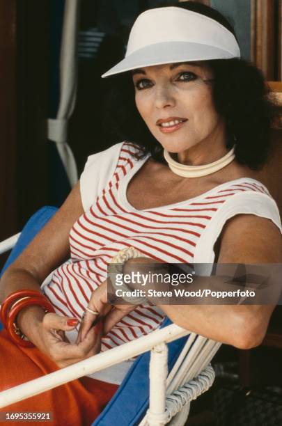 English actress Joan Collins, circa 1984. She is best known for her role as Alexis Colby in the American television series Dynasty. In 2015, Collins...