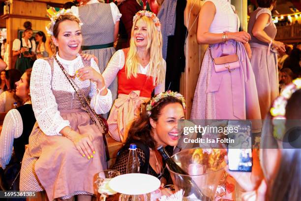 German actress Laura Osswald, German presenterTina Kaiser, and German presenter Nina Moghaddam during the Madlwiesn at Oktoberfest at...