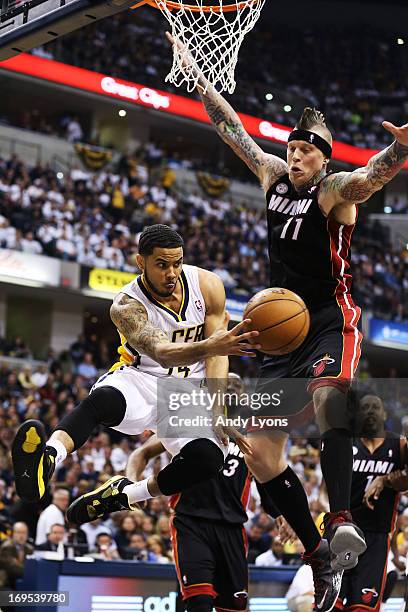 Augustin passes to David West of the Indiana Pacers around Chris Andersen of the Miami Heat during Game Three of the Eastern Conference Finals at...