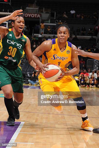 Dia Mathies of the Los Angeles Sparks drives to the basket during a game against the Seattle Storm at Staples Center on May 26, 2013 in Los Angeles,...