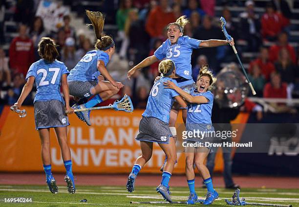 Aly Messinger, Taylor George, Sloane Serpe, Brittney Coppa and Emily Garrity of University of the North Carolina Tar Heels celebrate their 13-12...