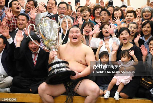 Mongolian Yokozuna, sumo's grand champion Hakuho , whose real name is Mnkhbatyn Davaajargal celebrates winning the Grand Sumo Summer Tournament at...