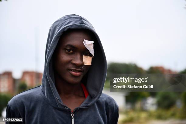 Migrant poses for a photo outside the Red Cross Refugee Center on September 22, 2023 in Turin, Italy. France and Italy will be securing their borders...