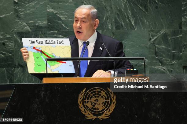 Prime Minister of the State of Israel Benjamin Netanyahu holds up a map as he speaks during the United Nations General Assembly at the United Nations...