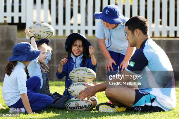 Jarryd Hayne helps out at a kids coaching clinic during a New South Wales Blues State of Origin training session at Coogee Oval on May 27, 2013 in...