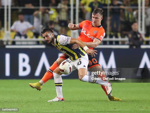 Eden Karzev of Istanbul Basaksehir, Dusan Tadic of Fenerbahce battles for the ball during the Turkish Super League match between Fenerbahce SK and...