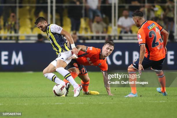 Eden Karzev of Istanbul Basaksehir, Dusan Tadic of Fenerbahce battles for the ball during the Turkish Super League match between Fenerbahce SK and...