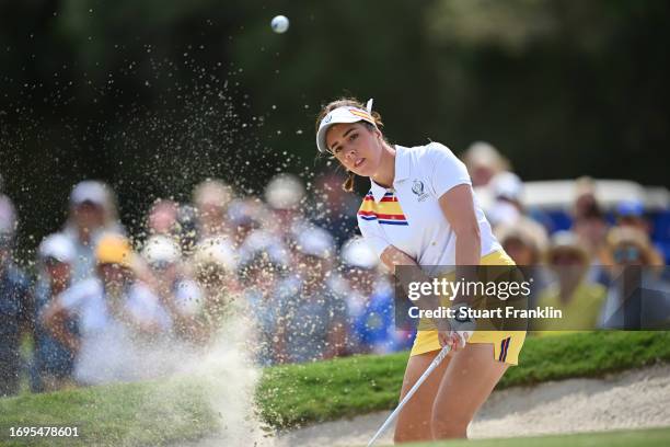 Georgia Hall of Team Europe plays a shot from a bunker on the sixth hole during Day One of The Solheim Cup at Finca Cortesin Golf Club on September...