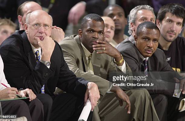 Assistant coach Bob Weiss, head coach Nate McMillan, and assistant coach Dwane Casey of the Seattle Sonics look on during the game against the Miami...