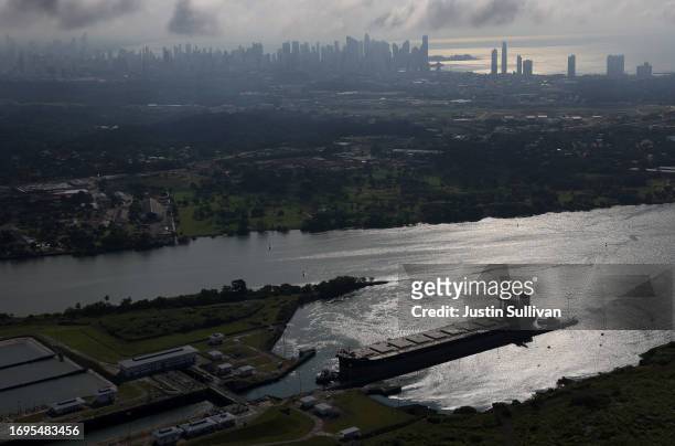 In an aerial view, a ship enters the Miraflores Locks as it transits through the Panama Canal on September 20, 2023 in Panama City, Panama. The...