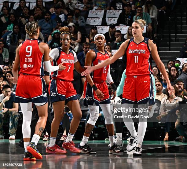 Elena Delle Donne high fives Natasha Cloud of the Washington Mystics against the New York Liberty during round one game one of the 2023 WNBA Playoffs...