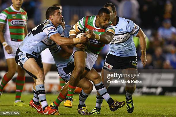 Roy Asotasi of the Rabbitohs is tackled during the round 11 NRL match between the Cronulla Sharks and the South Sydney Rabbitohs at Sharks Stadium on...