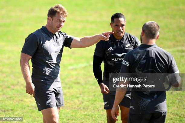 Sam Cane, Aaron Smith and Dane Coles of the All Blacks run through drills during a New Zealand All Blacks training session at Stade...