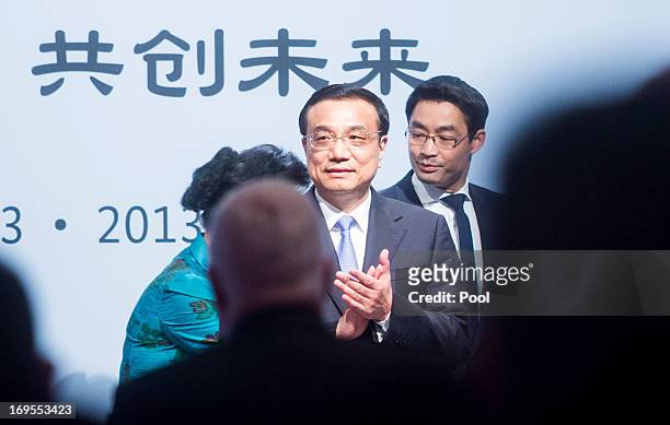 Chinese Prime Minister Li Keqiang and Economics Minister Rosler Phillp during a lunchtime reception for German and Chinese business representatives...