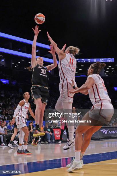 Breanna Stewart of the New York Liberty shoots the ball while Elena Delle Donne of the Washington Mystics plays defense on September 10, 2023 in...