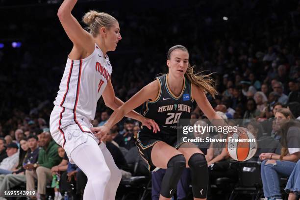Sabrina Ionescu of the New York Liberty drives to the basket while Elena Delle Donne of the Washington Mystics plays defense on September 10, 2023 in...
