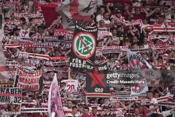 Supporters of Stuttgart cheer during the Bundesliga match between 1. FSV Mainz 05 and VfB Stuttgart at MEWA Arena on September 16, 2023 in Mainz,...