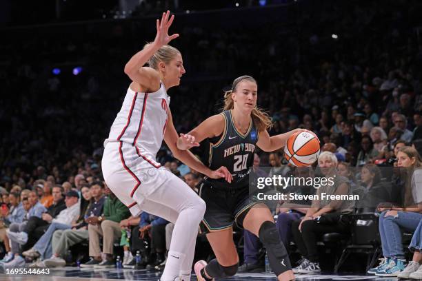 Sabrina Ionescu of the New York Liberty drives to the basket while Elena Delle Donne of the Washington Mystics plays defense on September 10, 2023 in...
